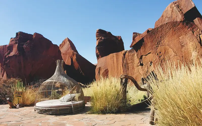 A private lounge among red desert rocks