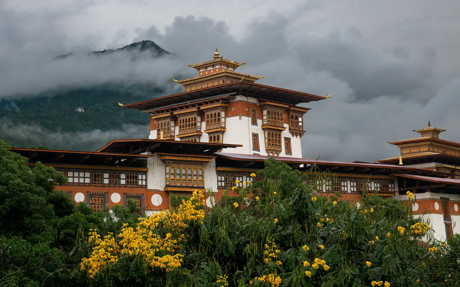 A temple fortress among mountains and flowers
