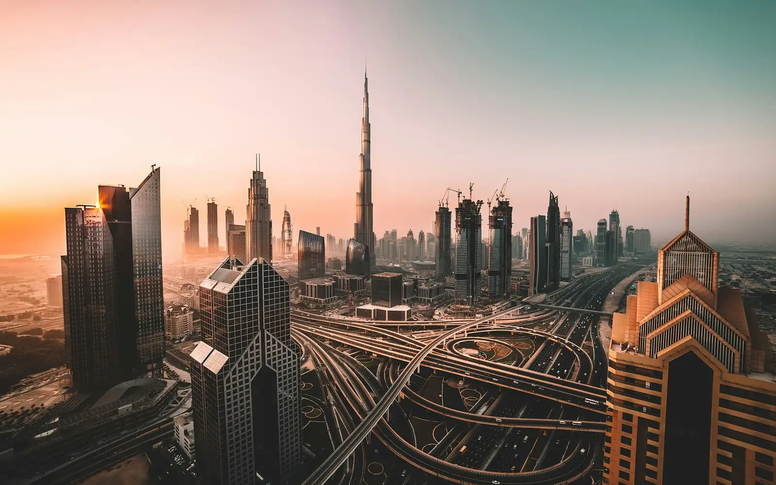 Dubai skyline and highways at sunset