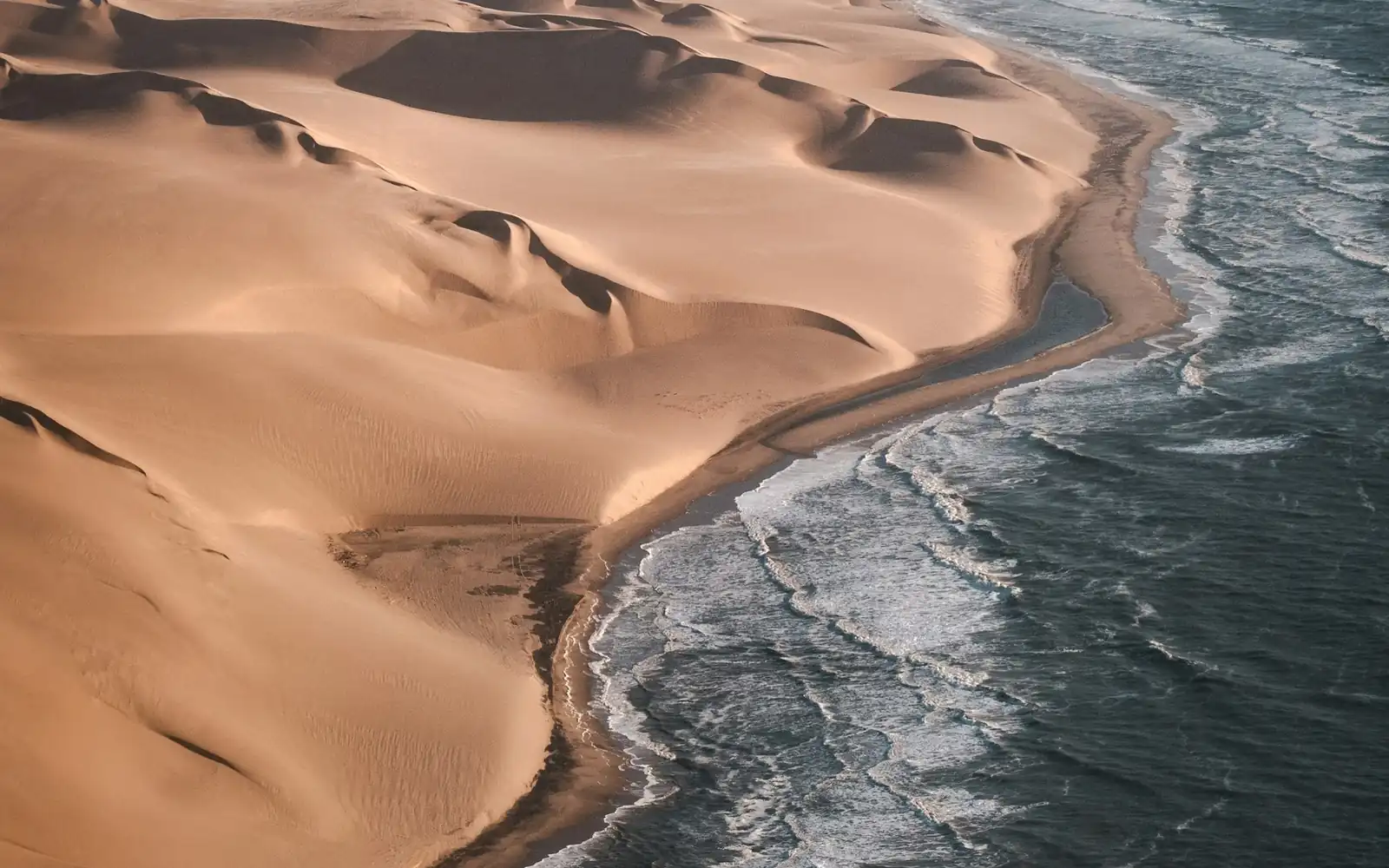 Dunes meeting the cold Atlantic on the Skeleton Coast