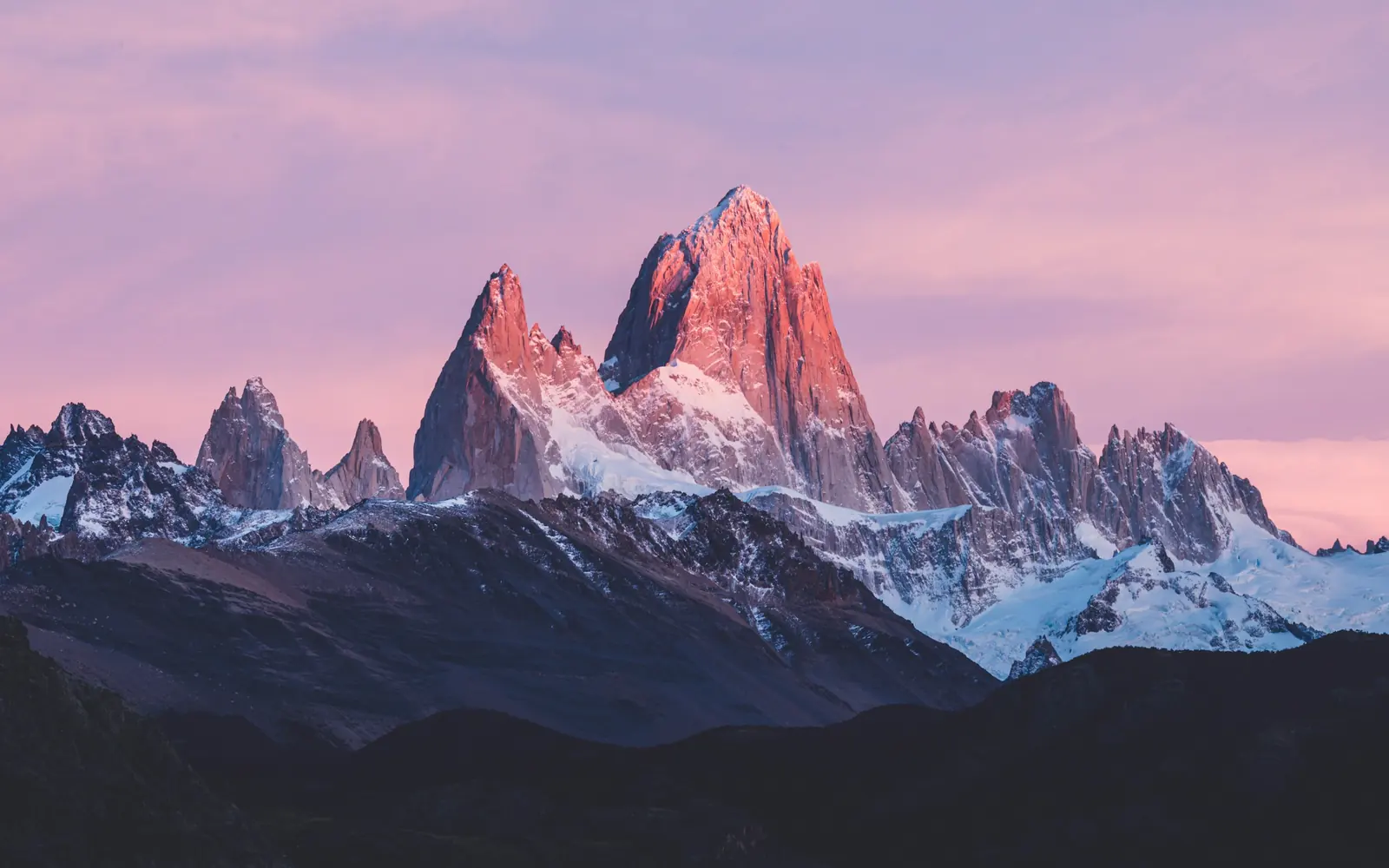 Pink alpenglow on a granite mountain