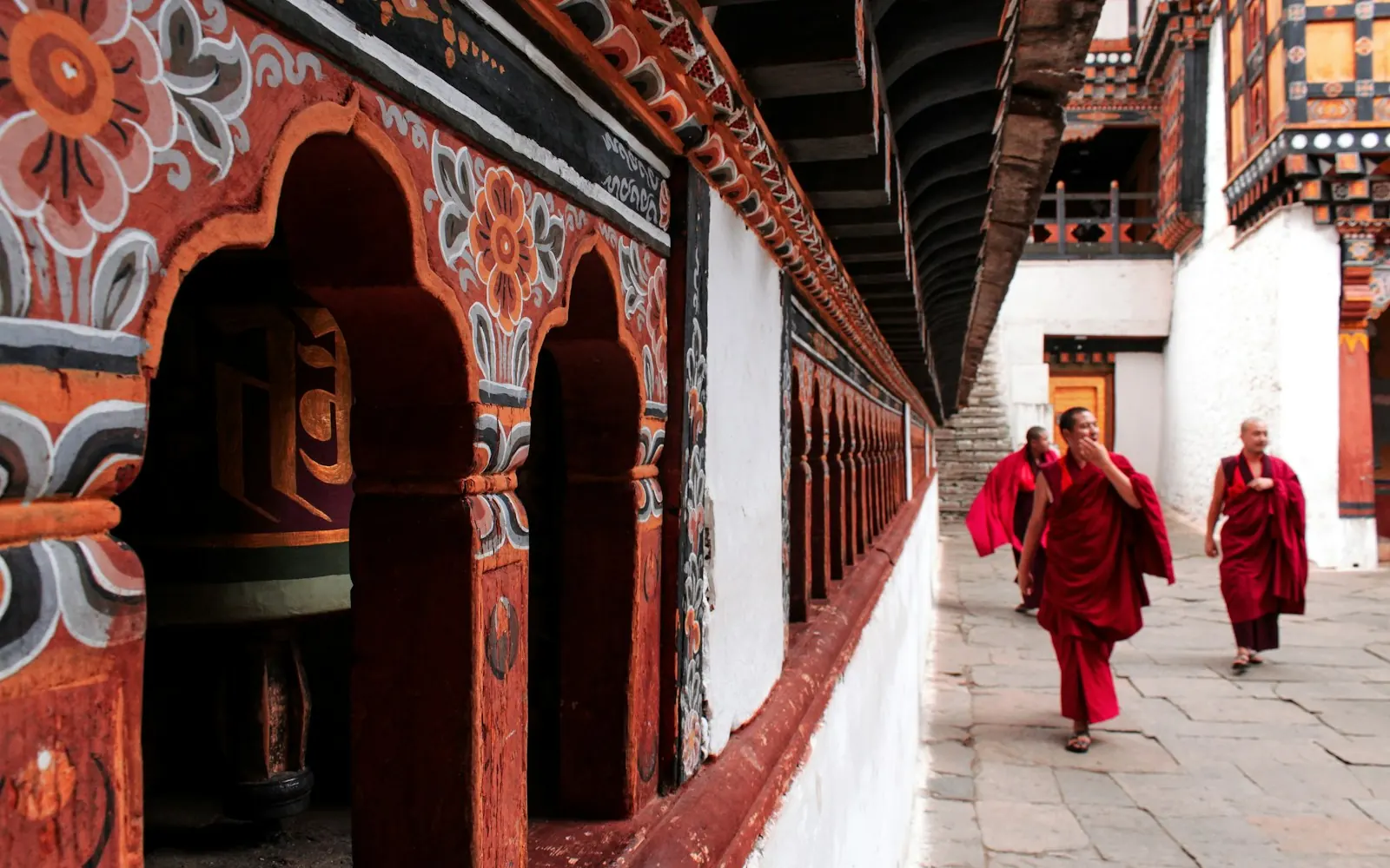 Monks in a prayer-wheel corridor