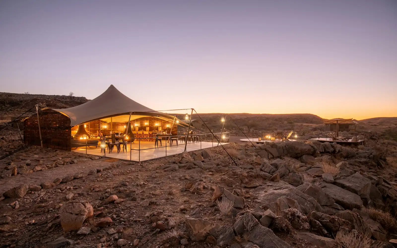 A luxury tented camp at sunset